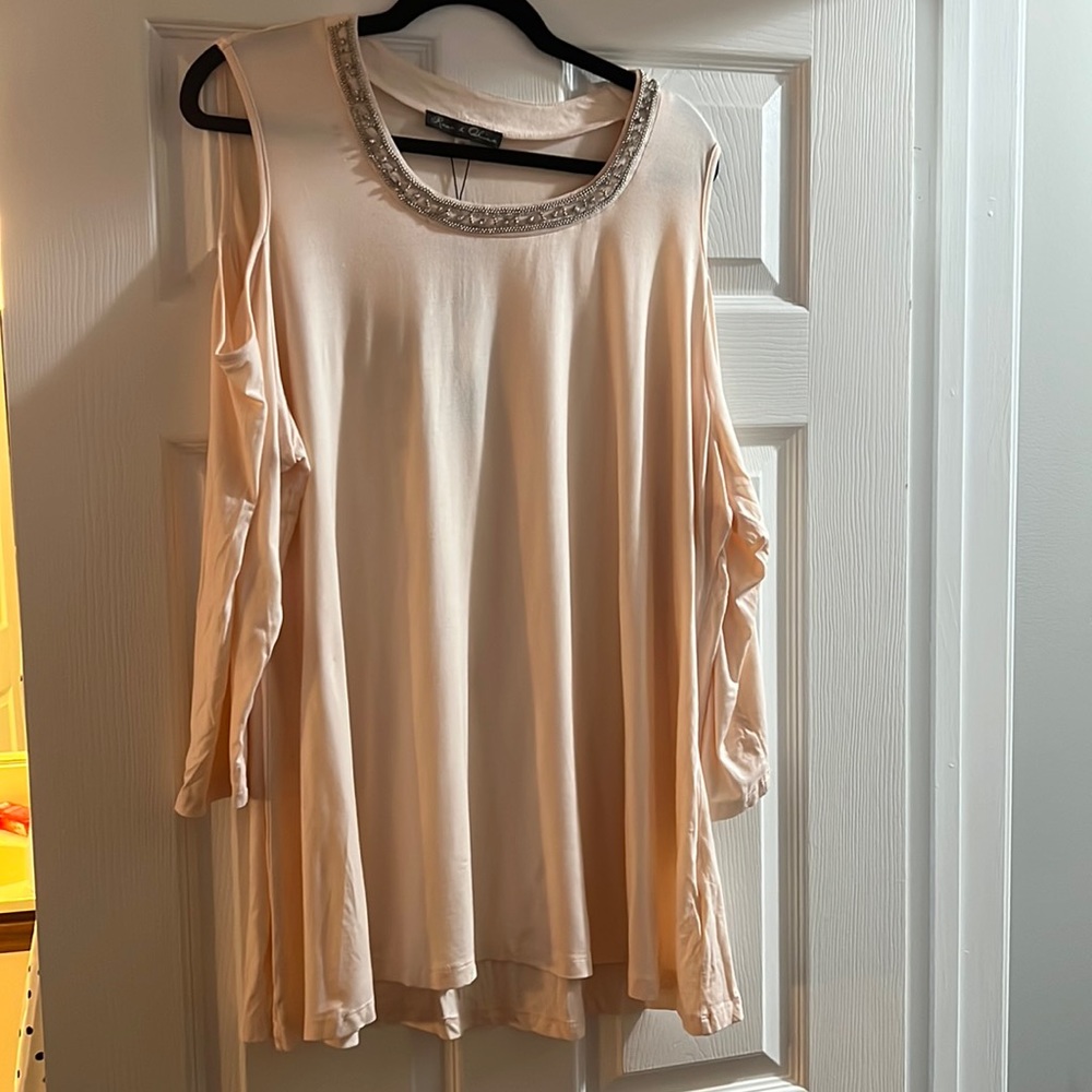 Cold shoulder blouse, light peach in color